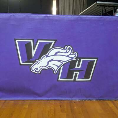 Mat covering stage at JRHS Gym