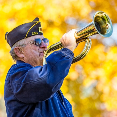 Playing the bugle.
